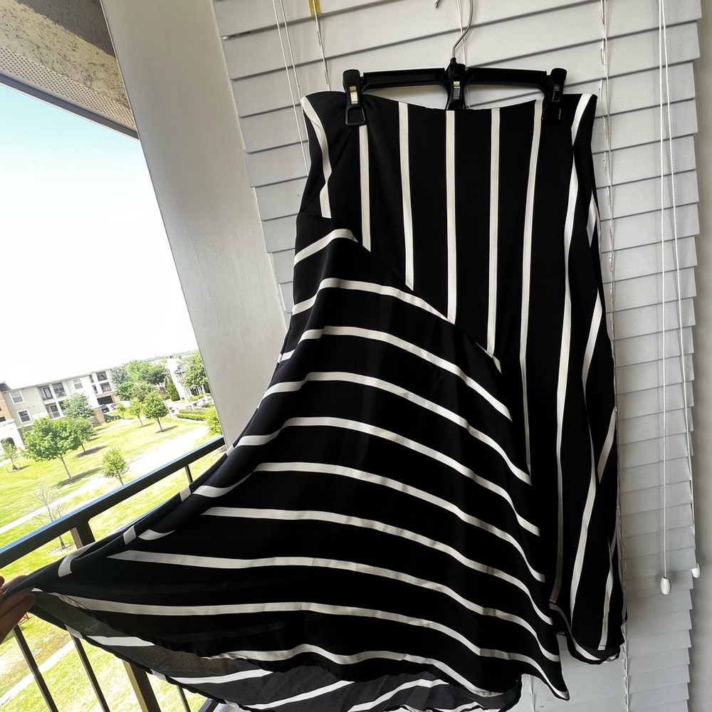 Skirt- Midi with flirty movement and flair